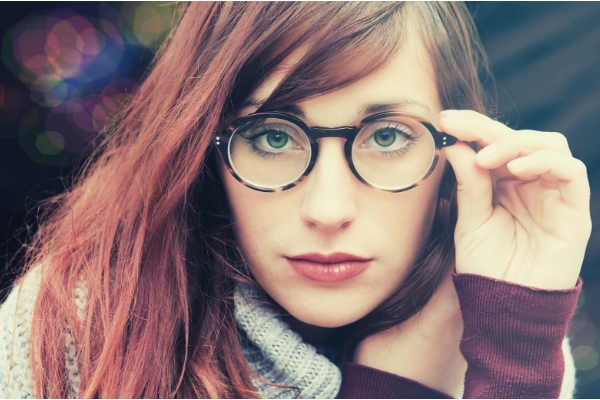 02-feature-woman-with-brown-hair-wearing-eyeglasses