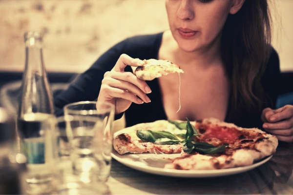 22-feature-girl-blowing-sliced-pizza