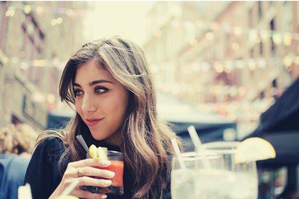 beautiful-girl-with-brown-hair-holding-beverage-in-new-york