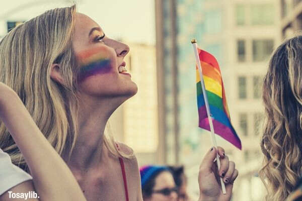 photo-of-a-woman-holding-LGBT-flag
