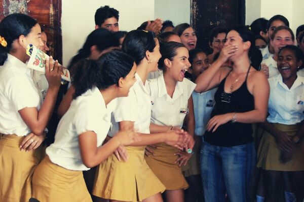 school-girls-laugh-with-their-teacher-in-trinidad-cuba