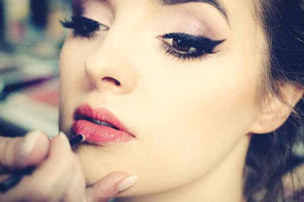 make-up-artist-applying-lipstick-on-a-model